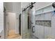 This bathroom features a glass-enclosed shower and convenient in-closet laundry at 5200 Woodmont Dr, Villa Rica, GA 30180