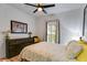 Bright bedroom with decorative window and ample storage with a large dresser at 5200 Woodmont Dr, Villa Rica, GA 30180