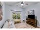 Cozy bedroom with couch, TV, and large window with plenty of light at 5200 Woodmont Dr, Villa Rica, GA 30180