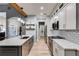 Galley kitchen with stainless appliances, white subway tile backsplash and large island at 5200 Woodmont Dr, Villa Rica, GA 30180