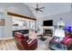 Open-concept living room with a fireplace, vaulted ceiling, and seamless flow to the kitchen at 5200 Woodmont Dr, Villa Rica, GA 30180