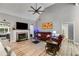 Spacious living room with a fireplace, a vaulted ceiling, and an open view to the sunroom at 5200 Woodmont Dr, Villa Rica, GA 30180