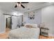This main bedroom features hardwood floors, a brick accent wall, and a barn-style door at 5200 Woodmont Dr, Villa Rica, GA 30180