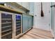 Mud room featuring a wine refrigerator, ample counter space, and easy access to the exterior at 5200 Woodmont Dr, Villa Rica, GA 30180