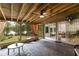 Screened-in porch with slate flooring and a serene view, perfect for enjoying the outdoors at 5200 Woodmont Dr, Villa Rica, GA 30180