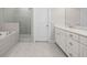Modern bathroom with a luxurious bathtub, tiled shower, and sleek vanity for a spa-like experience at 896 Farmstead Rd # 162, Suwanee, GA 30024