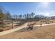Community dog park surrounded by grass and a walking path at 896 Farmstead Rd # 162, Suwanee, GA 30024
