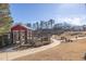 Dog park with a red shelter and walking trails in a pet-friendly community at 896 Farmstead Rd # 162, Suwanee, GA 30024