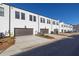 Row of new townhomes with attached garages and private driveway at 896 Farmstead Rd # 162, Suwanee, GA 30024