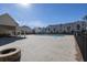Community pool area with a sun deck and outdoor seating at 896 Farmstead Rd # 162, Suwanee, GA 30024