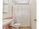 Cozy bathroom features a pedestal sink, toilet, and a shower with white shower curtain at 91 Rumson Ne Rd # B25, Atlanta, GA 30305
