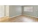 Comfortable bedroom with neutral color scheme and light wood-look flooring at 91 Rumson Ne Rd # B25, Atlanta, GA 30305