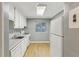 Cozy kitchen with ample cabinetry, modern appliances, and a bright window at 91 Rumson Ne Rd # B25, Atlanta, GA 30305