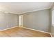 Spacious living room featuring wood floors, neutral paint, and natural light at 91 Rumson Ne Rd # B25, Atlanta, GA 30305