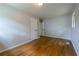 Spacious bedroom featuring hardwood floors, light walls, and a closet at 115 Delmoor Nw Dr, Atlanta, GA 30311