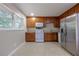 Bright kitchen features wooden cabinets, stainless steel appliances, and ample counter space at 115 Delmoor Nw Dr, Atlanta, GA 30311