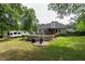Landscaped backyard with an above-ground pool, deck, green grass, and a camper at 128 Champion Way, Hiram, GA 30141