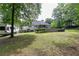 Backyard with lush lawn, above-ground pool, deck, and a camper at 128 Champion Way, Hiram, GA 30141