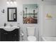 Modern bathroom featuring beach themed decoration, a shower-tub combo and sleek sink at 128 Champion Way, Hiram, GA 30141