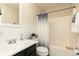 Bathroom featuring a shower-tub combo, stylish white wainscotting and modern fixtures at 128 Champion Way, Hiram, GA 30141