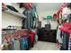 Spacious walk-in closet with shelving, hanging racks, carpet, and a dresser at 128 Champion Way, Hiram, GA 30141