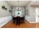 Cozy dining room with decorative curtains, modern lighting, and seating for six, perfect for gatherings at 128 Champion Way, Hiram, GA 30141