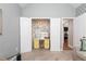 Home office with cheerful yellow accents, closet, floral wallpaper, and natural light at 128 Champion Way, Hiram, GA 30141