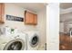 A laundry room with a laundry sign, a washer and dryer, and access to the living room at 128 Champion Way, Hiram, GA 30141