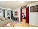 Finished basement with an entertainment space that has hardwood floors and comfortable seating at 128 Champion Way, Hiram, GA 30141