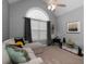 Bright living room featuring high ceilings, neutral tones, large window, and comfortable seating at 128 Champion Way, Hiram, GA 30141