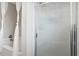 Glass enclosed shower area with a white linen shower curtain hanging next to it at 2540 Park Ave, Austell, GA 30106