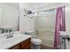 Bathroom with a shower-tub combo, vanity, toilet, and large mirror at 2540 Park Ave, Austell, GA 30106
