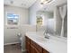 Bathroom with tile floors, window, vanity and toilet at 2540 Park Ave, Austell, GA 30106