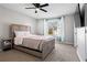 Bedroom featuring a full sized bed, ceiling fan, and a view of the outside at 2540 Park Ave, Austell, GA 30106