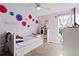 Bright bedroom featuring a twin bed and lots of cute decorations at 2540 Park Ave, Austell, GA 30106