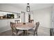 Comfortable dining area features tile flooring and an open layout to the kitchen and living room at 2540 Park Ave, Austell, GA 30106