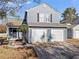 Front exterior of a two-story house with a two-car garage and a nicely maintained lawn at 2540 Park Ave, Austell, GA 30106