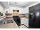 Well-lit kitchen featuring stainless steel appliances, granite countertops, and white cabinetry at 2540 Park Ave, Austell, GA 30106