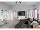 Open-concept living room boasting tile floors, neutral paint, and lots of room to entertain at 2540 Park Ave, Austell, GA 30106