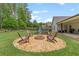 Well-maintained backyard with fire pit and a playground, ideal for Gathering fun and relaxation at 31 Copper Leaf Ct, Villa Rica, GA 30180