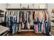Walk-in closet with custom shelving, hanging rods, and hardwood flooring; perfect for organized storage at 31 Copper Leaf Ct, Villa Rica, GA 30180