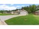 Desirable home boasting a sprawling lawn, elegant curb appeal, and an attached two-car garage at 31 Copper Leaf Ct, Villa Rica, GA 30180
