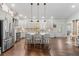 Bright, open-concept kitchen features a large island, modern appliances, and sleek countertops at 31 Copper Leaf Ct, Villa Rica, GA 30180