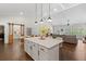 Modern kitchen with a large island, pendant lighting, and an open layout for seamless entertaining at 31 Copper Leaf Ct, Villa Rica, GA 30180