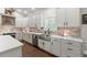 Bright kitchen with stainless steel appliances, marble countertops, and wooden flooring offers great cooking space at 31 Copper Leaf Ct, Villa Rica, GA 30180