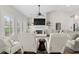 Cozy living room with natural light, a fireplace, and comfortable seating arrangement at 31 Copper Leaf Ct, Villa Rica, GA 30180