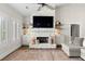 Cozy living room with stone fireplace, built-in shelving, and white trim for a relaxing atmosphere at 31 Copper Leaf Ct, Villa Rica, GA 30180