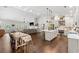 Open living space with a modern kitchen, wood floors, and a comfortable sitting area for relaxing and entertaining at 31 Copper Leaf Ct, Villa Rica, GA 30180