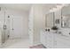 Contemporary main bathroom with double vanity, framed mirrors, modern fixtures, and glass shower at 31 Copper Leaf Ct, Villa Rica, GA 30180