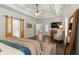 Spacious main bedroom with wood floors, decorative rug, and private bathroom entrance with sliding door at 31 Copper Leaf Ct, Villa Rica, GA 30180